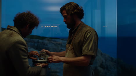 two men working on a model