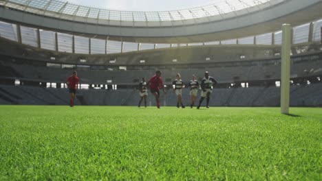 rugby players playing rugby match in stadium 4k