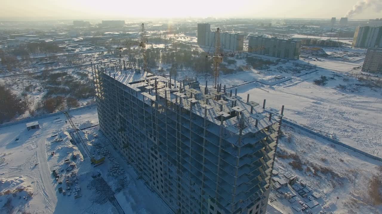 Aerial view of a building under construction in winter