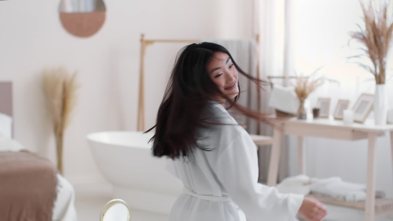 Happy Woman Dancing in a Bathroom