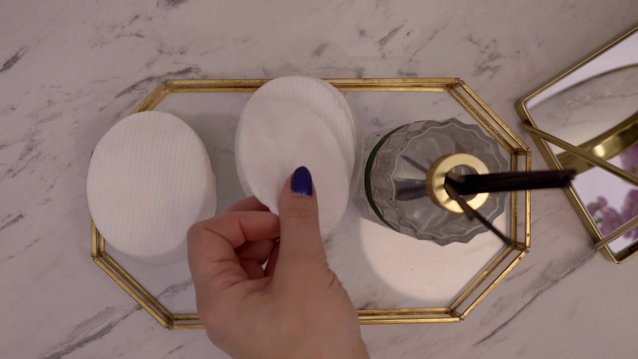 Beauty salon, a cosmetologist prepares a cosmetic pad for the treatment