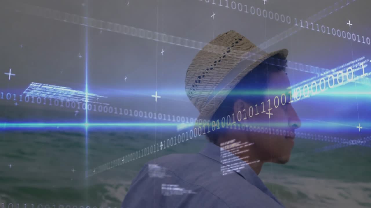 man in straw hat standing at shore as binary overlay appearing and spreading for technology demo