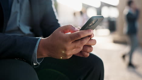 businessman using smartphone outdoors