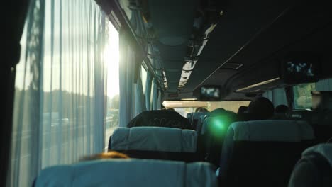 view from inside the passenger bus with tourists. travel by bus and tourism concept