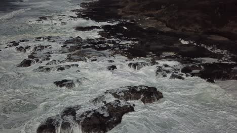 strong waves crashing against rocks