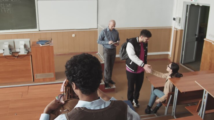 Multiethnic Students Taking their Seats in Auditorium before Lesson