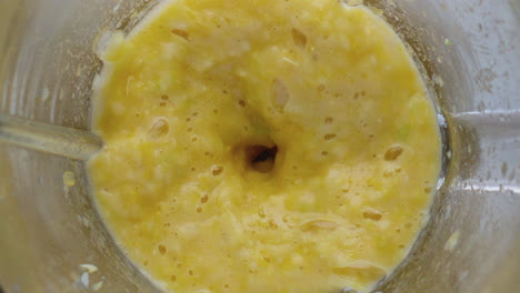 cutting fruits blender bowl closeup. preparing homemade natural vitamin cocktail