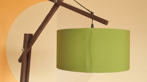 wooden floor lamp with green lampshade