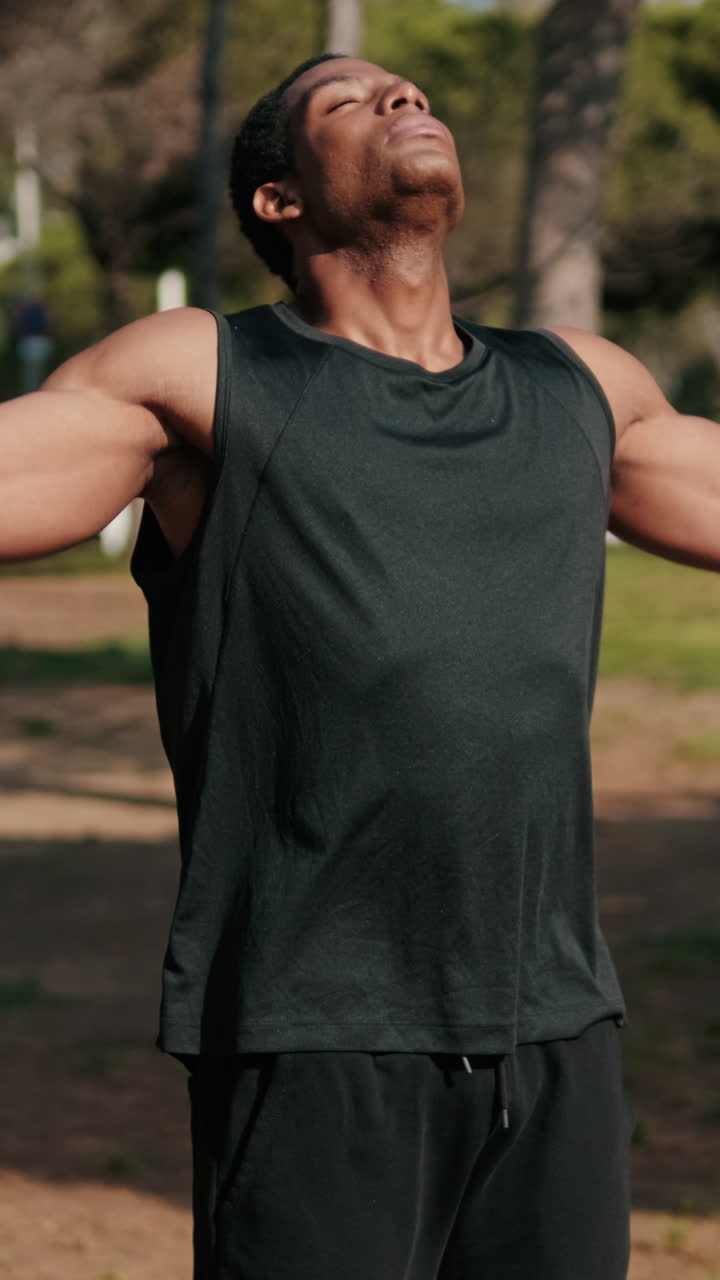 Young Athlete Breathing Deeply in Park
