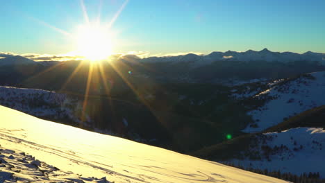 cinematic epic ikon winter vail pass colorado golden hour sunset sunlight last light powder above tree line rocky mountain landscape backcountry scenic pan to the left movement