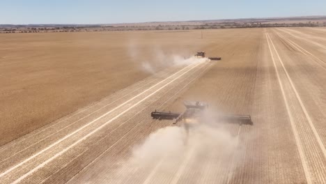 This-footage-captures-the-synergy-of-modern-agricultural-technology,-showcasing-the-essential-role-of-header-fronts-in-the-wheat-harvesting-process