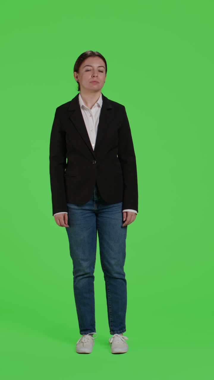 Vertical video: Front view of young businesswoman acting confident