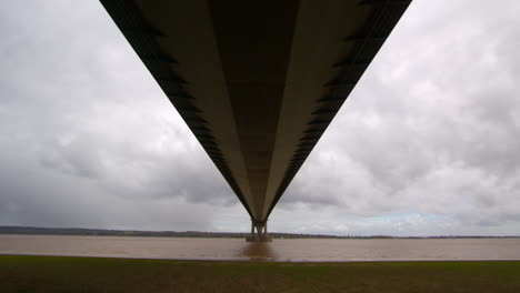 wide shot looking up under the humber bridge on the south shore