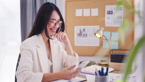 Happy-Confident-Businesswoman-Browsing-Internet-on-Smartphone