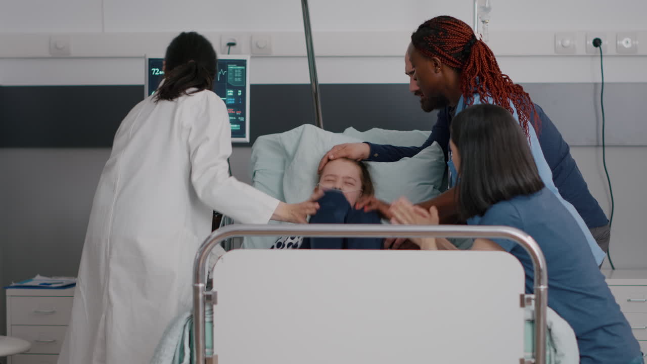 Pediatrician woman doctor holding sick little child monitoring disease symptom