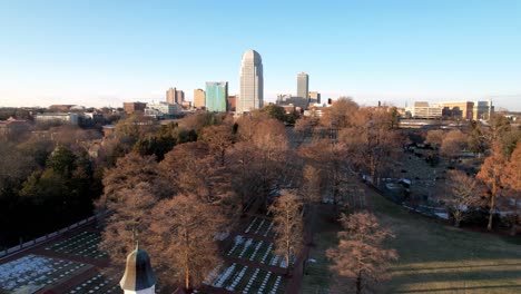 aerial over old salem pushing toward winston salem nc, north carolina skyline