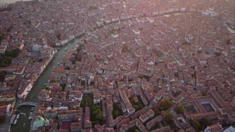 aerial shot of rooftops in venice lit by morning sunshine, italy