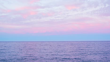 seascape and colorful sky above, static view