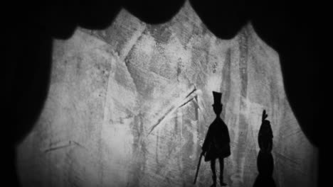 shadow puppet show with mountains and man