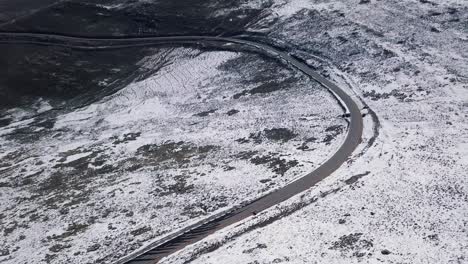 aerials of snowy landscape in lesotho, africa - snow fall in africa car driving on roads in snowy landscape