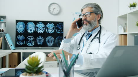 doctor talking on phone in office