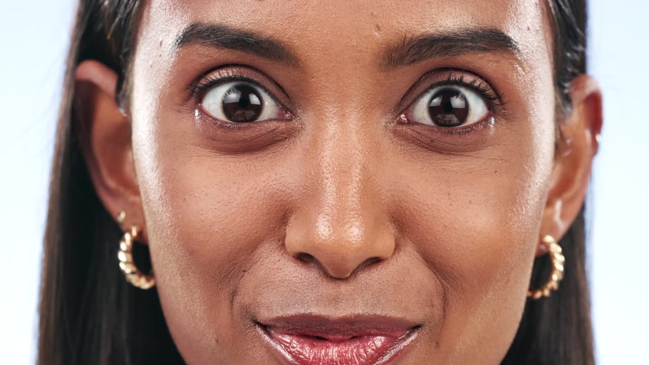 Excited, eyes and woman face in studio