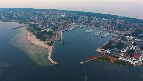 aerial view of drone flying around the marina with moored yachts