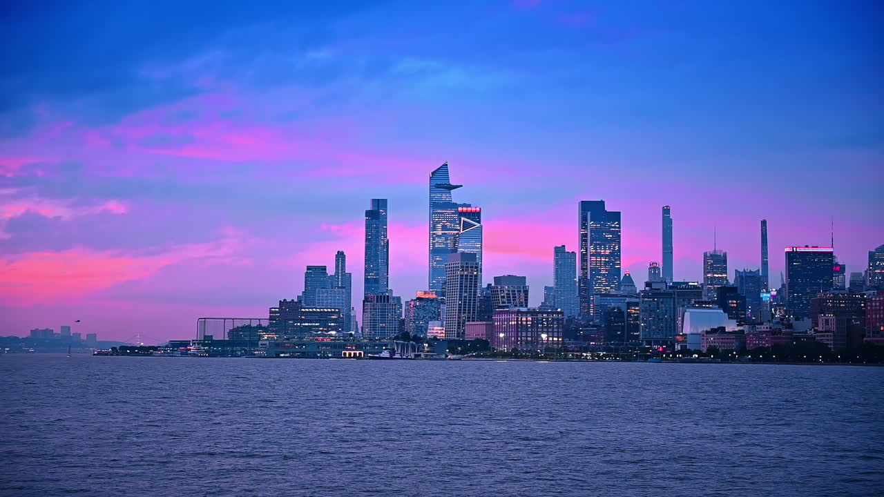 Amazing blue and pink sky in the time of dusk. New York skyline on the waterfront