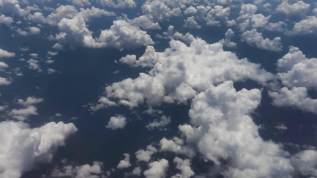 view of airplane cabin, white clouds