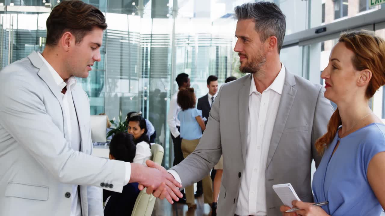 Business people shaking hands in office