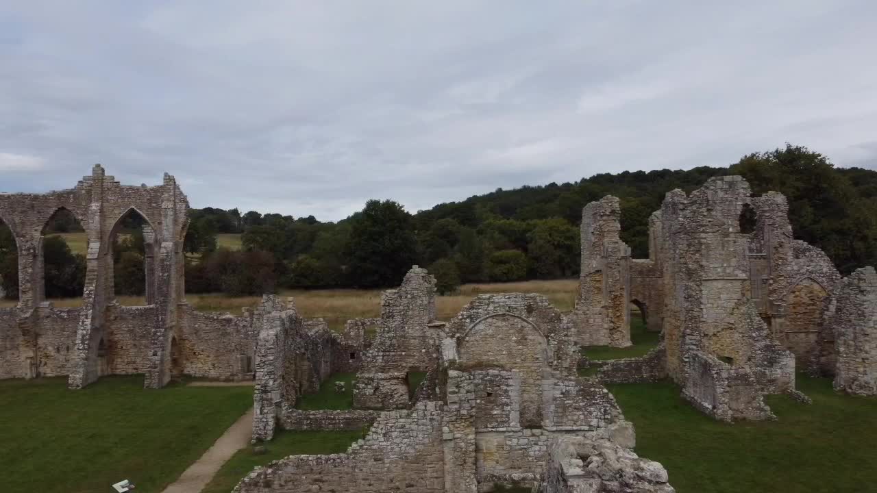 Seamless drone transition from the majestic Abbey Arches to the sprawling ruins of Bayham Old Abbey, a testament to time and history