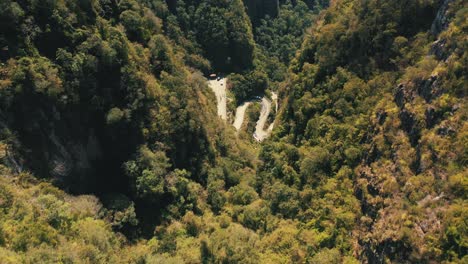 aerial view top down view of tropical rainforest mountain road, serra do corvo branco, grão pará, santa catarina, brazil