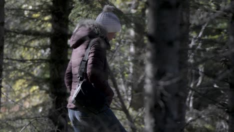 female tourist hiker in iceland's dense forest