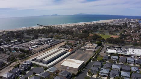 high panning aerial shot of an industrial park in port hueneme with the channel islands visible in the distance