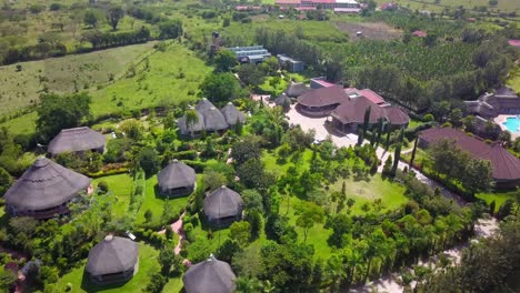 aerial view over emburara farm lodge in uganda - drone shot