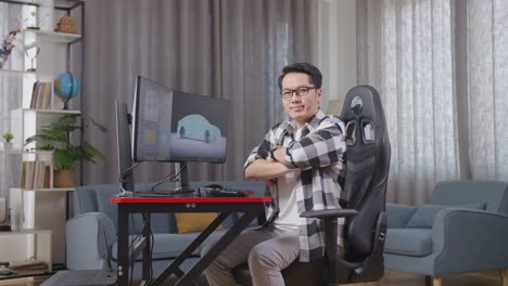 man working on computer at home