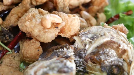 Close-Up-Footage-of-Thai-Style-Deep-Fried-Fish-Served-With-Palm-Sugar-Sweet-and-Spicy-Sauce