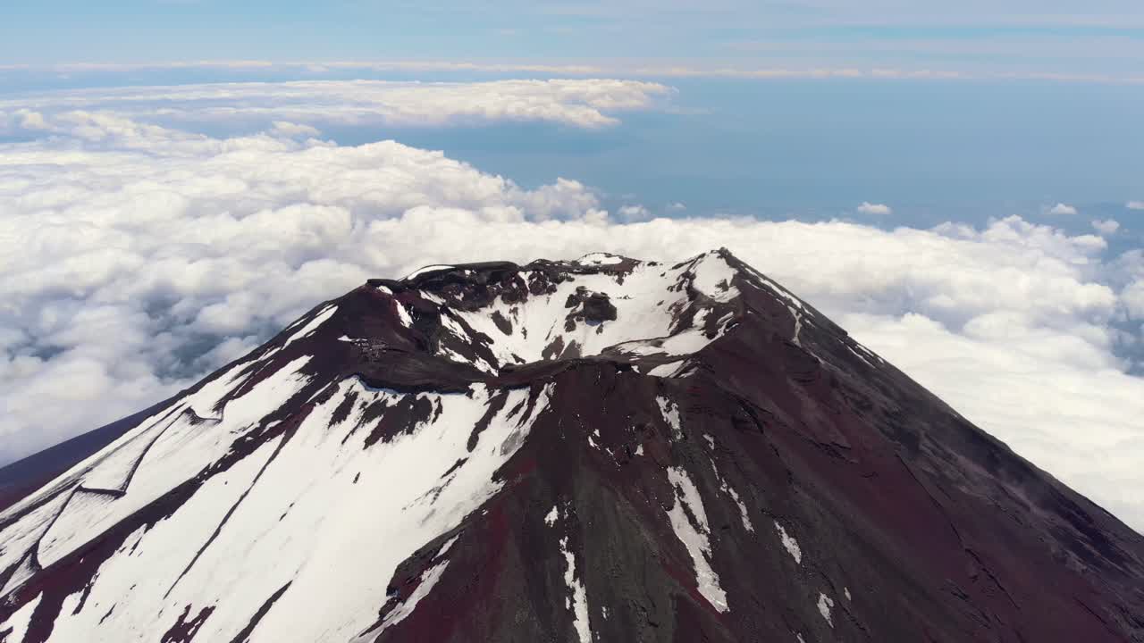 Aerial Drone Flyover of Mount Fuji Crater and Snow Capped Peak, Japan