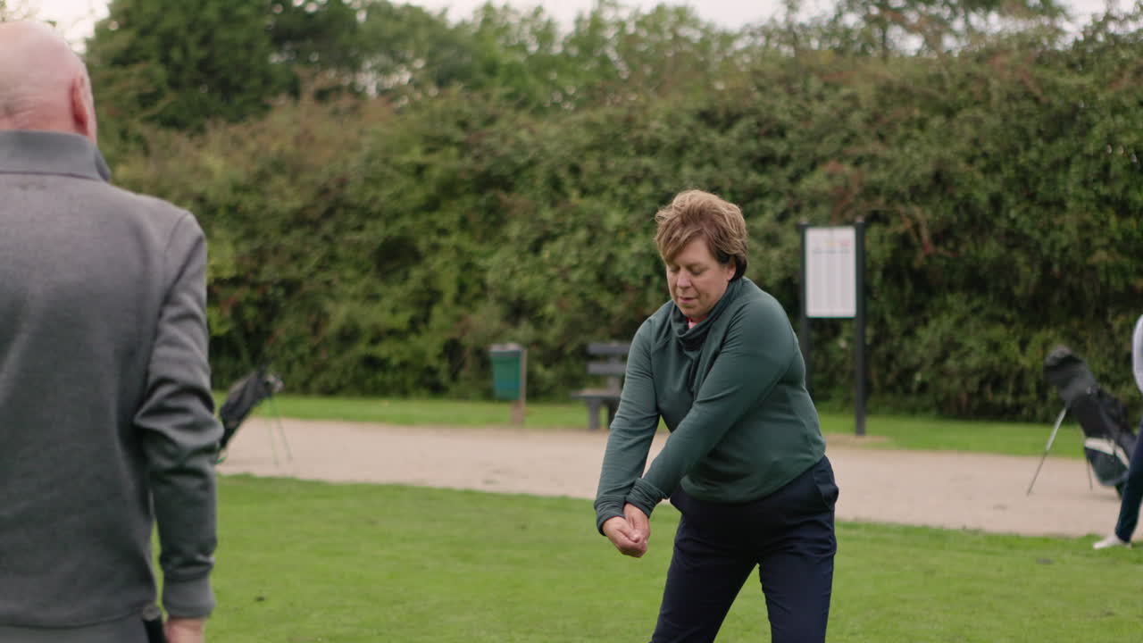 People playing golf on a golf course