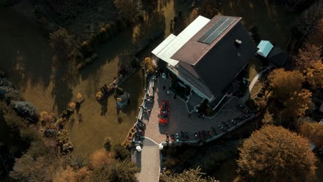 bird eye view of motorbike meeting in front of single-family house in the countryside