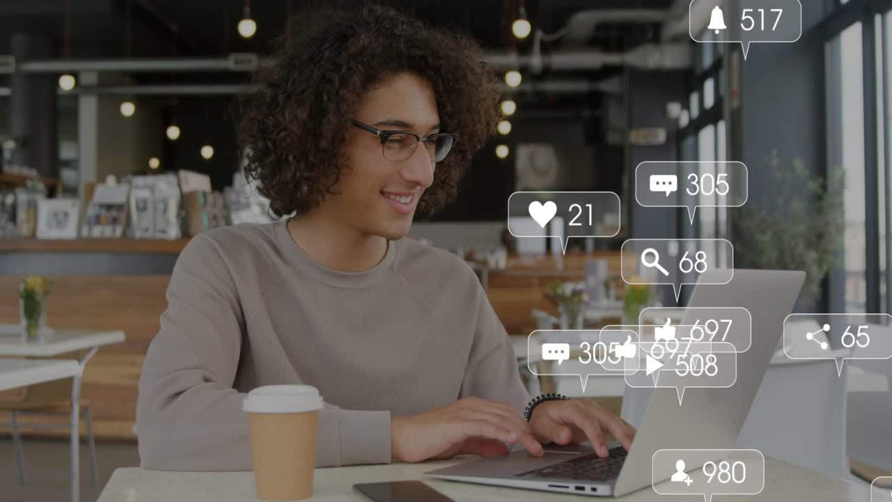 Man tapping phone and typing on laptop, initiating floating alerts showing social media engagement