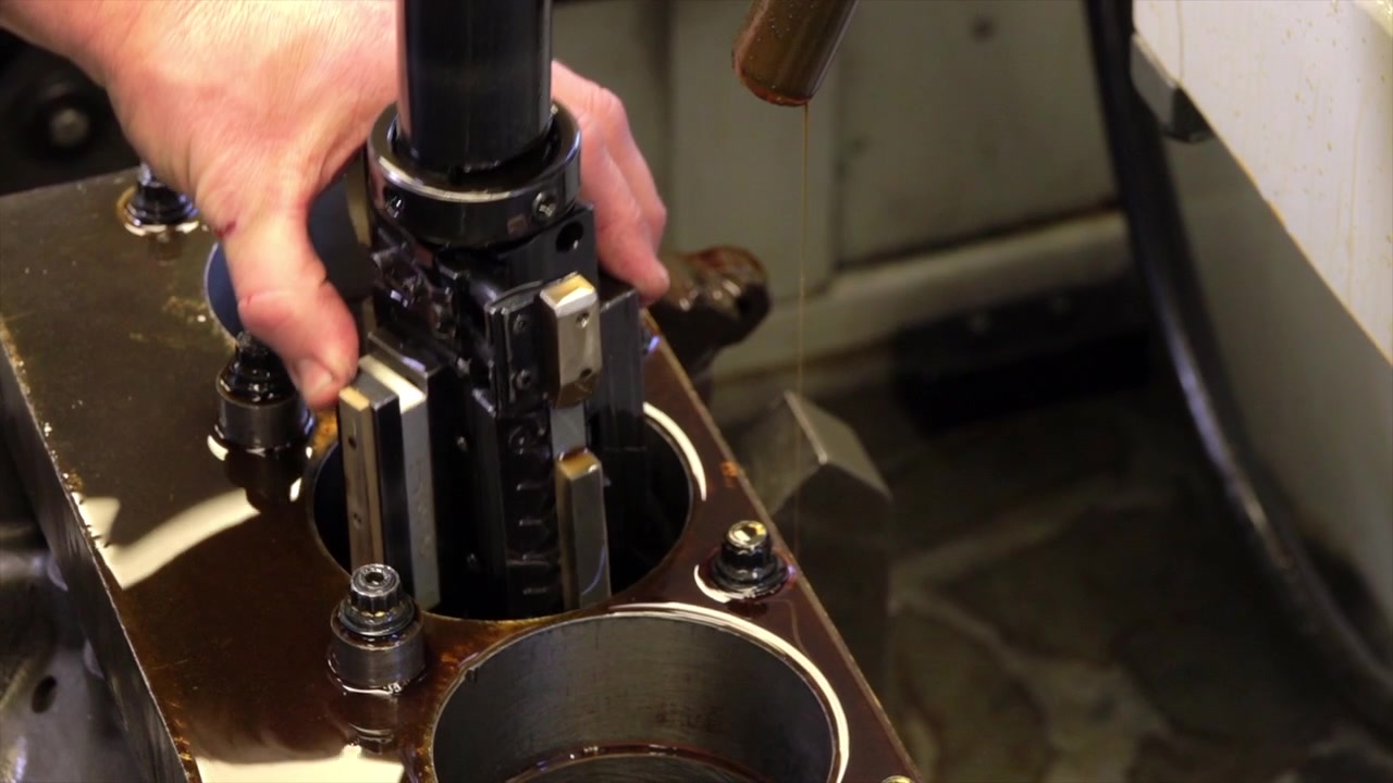 Moving close up of engine being prepared for work