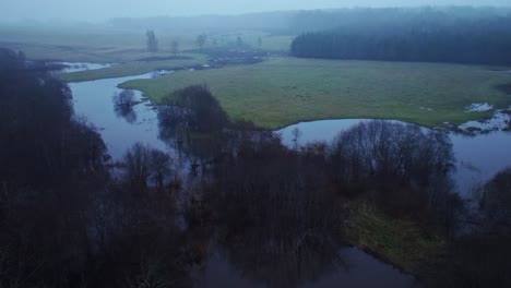 overcast autumn flooding on sventāja river at latvia lithuania border calm drone