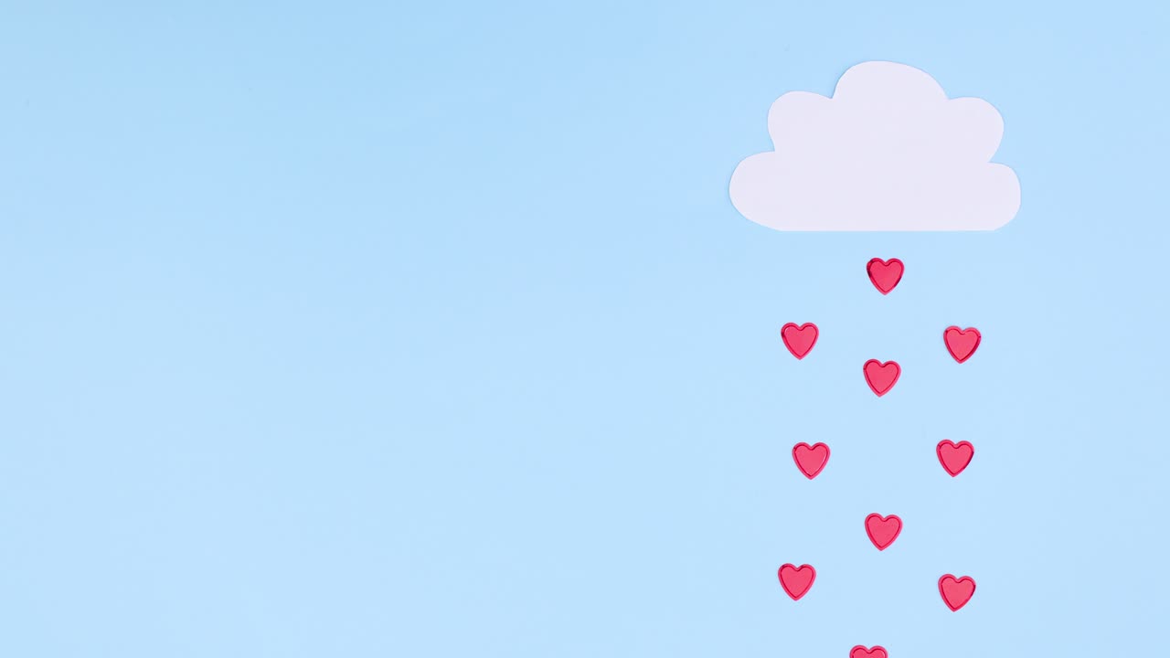 lloviendo corazones de la nube blanca en el tema azul. día de san valentín stop motion