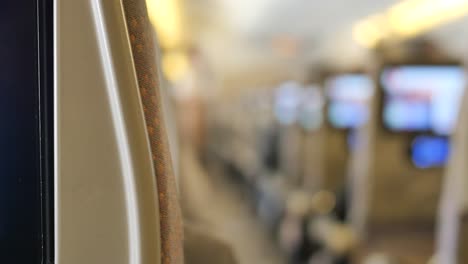 Purple--empty-passenger-airplane-seats-in-the-cabin,