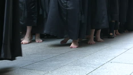 barefoot procession in robes