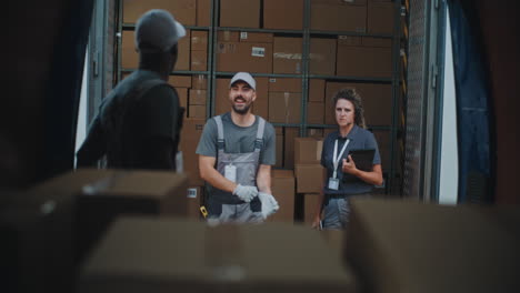 logistics team managing packages in a delivery truck