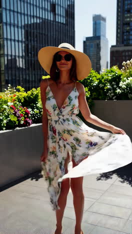 stylish woman in a floral dress on a rooftop