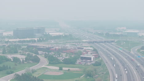 heavy wildfire smoke over mississauga, poor air quality, hazy view of the cityscape