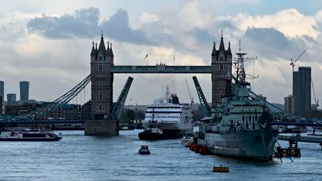 large ship reversing out of tower bridge, london, united kingdom